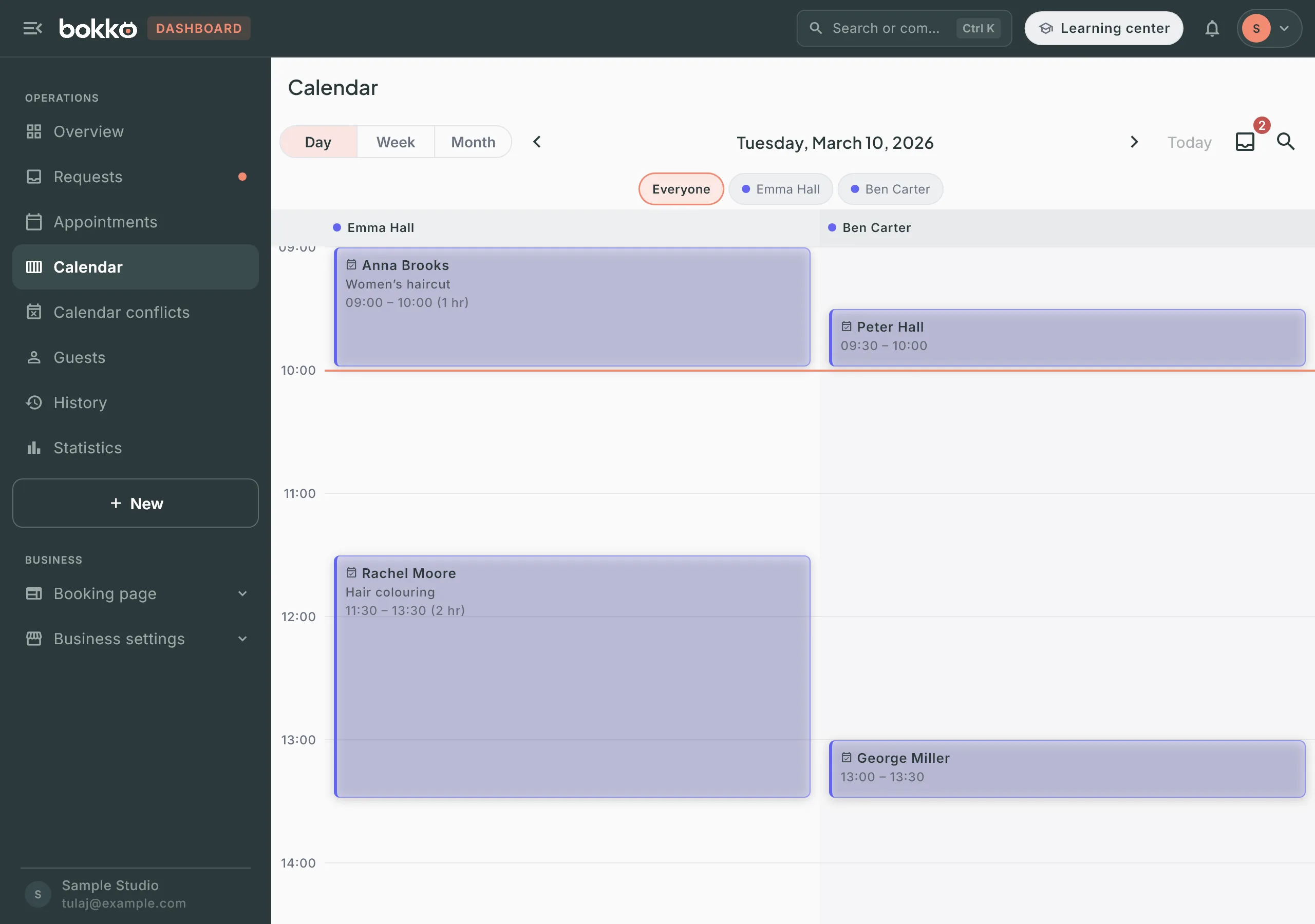 The Calendar day view with two staff columns and four confirmed appointments